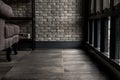 Minimalist interior of living room with sofa, brick wall and windows, Loft style room. Copy space