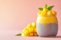 A minimalist jar of chia pudding topped with mango puree, styled on a Royalty Free Stock Photo