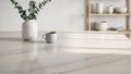 Minimalist kitchen countertop with a white vase of eucalyptus and a coffee mug on a marble surface Keywords: kitchen Royalty Free Stock Photo