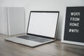 Minimalist laptop mockup white screen on white table with mouse. work from home concept Royalty Free Stock Photo