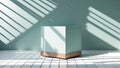 Minimalist light blue rectangular object with wooden base casting dramatic shadows on a pale green wall Royalty Free Stock Photo
