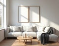 Minimalist living room with sectional sofa, round coffee table, and blank wall frames. Sunlight streams through window onto Royalty Free Stock Photo