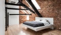 A minimalist loft bedroom with a floating platform bed, exposed brick walls, and a