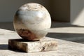 Abstract Marble Sphere Sculpture in Sunlit Architectural Setting - Modern Art for Interior Decor Generative AI Royalty Free Stock Photo