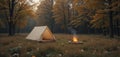Minimalist Meadow Camp A Clean and Simple Autumn Camping Scene of Basic Tent and Subtle Campfire Glow in a Forest Meadow Royalty Free Stock Photo