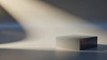 Minimalist Metallic Cube on a Smooth Surface with Dramatic Spotlight and Shadow Play Royalty Free Stock Photo