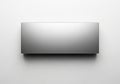 Minimalist metallic rectangular object against a plain background Royalty Free Stock Photo