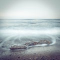 Minimalist misty seascape with rocks