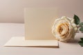 Minimalist mockup of blank greeting card with rose.