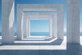 Minimalist modern concrete structure with geometric openings overlooking a calm ocean and clear blue sky creating striking light Royalty Free Stock Photo