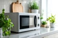 Minimalist modern microwave oven in clean kitchen interior Royalty Free Stock Photo