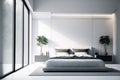 Minimalist modern white bedroom. Cozy white and grey room minimal concept, bed with a lot of pillows, white walls and green plants Royalty Free Stock Photo