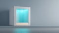 Minimalist modern white display cube with glowing blue interior lighting against plain gray wall in empty room Royalty Free Stock Photo