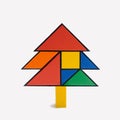 Minimalist Mondrian style Christmas tree created of tangram puzzles. Optimistic snow white background