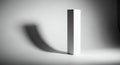 Minimalist monochrome composition with stark white geometric form casting elongated shadow Royalty Free Stock Photo