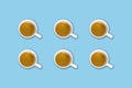 Minimalist pattern with a top view of a group of coffee cups on a light blue pastel table