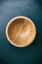 Minimalist photo of an empty bowl of baboo on slate table