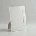 A minimalist photo frame on a plain, light-colored surface. The frame is rectangular Royalty Free Stock Photo