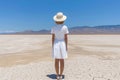 Minimalist portrait of a woman surrounded by the tranquil beauty of the desert landscape