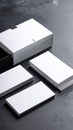 Minimalist presentation of blank business cards in a white box on a dark textured surface Royalty Free Stock Photo