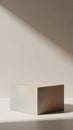 Minimalist rectangular podium with soft iridescent reflections and diagonal light and shadow on a neutral background Royalty Free Stock Photo