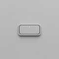 A minimalist, rectangular push button centered on a gray background. The button Royalty Free Stock Photo