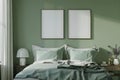 Minimalist sage green bedroom decor with two frames above bed. Concept Minimalist Bedroom Decor,