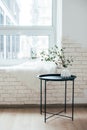 Minimalist Scandinavian home interior, coffee table arrangement in white room