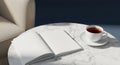 Blank Open Book Mockup on Marble Table with Tea Cup and Sofa Accent Royalty Free Stock Photo