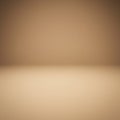 A minimalist scene featuring a smooth, beige surface and background, creating a Royalty Free Stock Photo