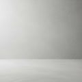 Minimalist scene featuring a smooth, light gray wall above a slightly textured, gray Royalty Free Stock Photo