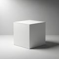 A minimalist scene featuring a white cube centered on a smooth, gray surface. The cube\'s clean, Royalty Free Stock Photo