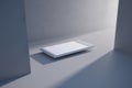 Minimalist scene with a white rectangular object on a light gray surface Royalty Free Stock Photo