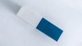 Blue and White Eraser on White Background Royalty Free Stock Photo