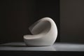 a minimalist sculpture made of smooth white stone