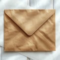Minimalist setting brown envelope placed on white table under soft, natural lighting Royalty Free Stock Photo