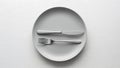 Minimalist setting empty plate with fork and knife silverware Royalty Free Stock Photo