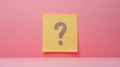 Yellow Sticky Note With Question Mark on a Pink Background Symbolizing Uncertainty Royalty Free Stock Photo