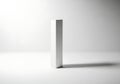 Minimalist silver rectangular object casting a shadow on a white background Royalty Free Stock Photo