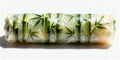Minimalist spring roll styled with bamboo texture, isolated on white background, modern culinary concept Royalty Free Stock Photo