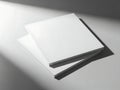 Minimalist stack of blank paper under soft light Royalty Free Stock Photo