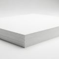 Minimalist stack of pristine white paper on a clean surface Royalty Free Stock Photo