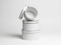Minimalist stack of white cylindrical containers isolated on white background Royalty Free Stock Photo