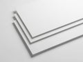 Minimalist stack of white paper sheets on a clean surface Royalty Free Stock Photo