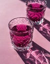 Minimalist still life of cranberry red glasses.