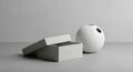 Minimalist Still Life: Open White Textured Box and Smooth Egg-Shaped Vase on Gray Surface Royalty Free Stock Photo