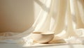 Minimalist studio still life features fabric drape backdrop with ceramic bowl in sunlight. Soft light creates gentle shadows. Royalty Free Stock Photo