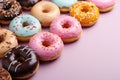 Minimalist style top view of assorted donuts on light brown