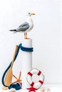 Minimalist Illustration of a Seagull on a White Post with Nautical Elements on White Background Royalty Free Stock Photo