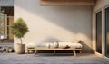 Minimalist Sunlit Patio with Sleek Daybed and Potted Olive Tree Royalty Free Stock Photo